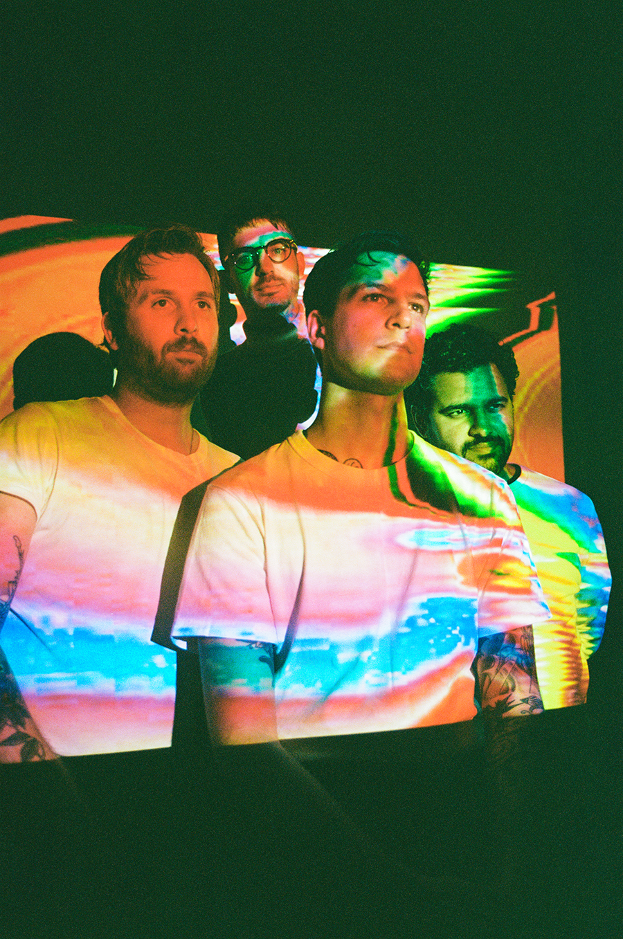 The four band members of Crows with psychedelic lights