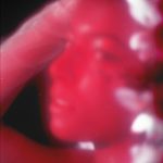 album cover, pink woman looking over her shoulder